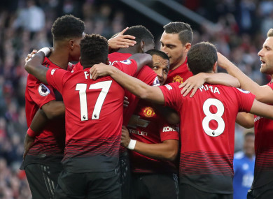 Manchester United's Paul Pogba (obscured) celebrates scoring his side's first goal.
