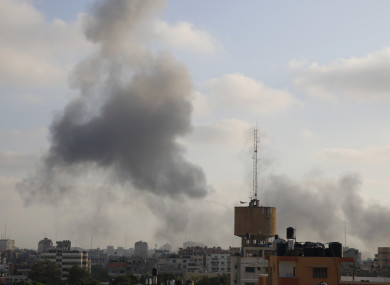 Smoke rises from an explosion caused by an Israeli airstrike in Gaza City yesterday