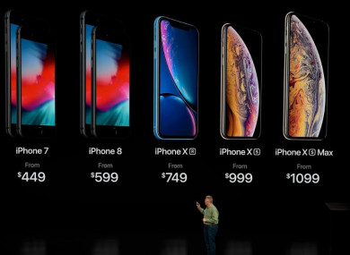 Phil Schiller, Apple's senior vice president of worldwide marketing, speaks about the prices of the newly released iPhones at the Steve Jobs Theater in Cupertino, California.