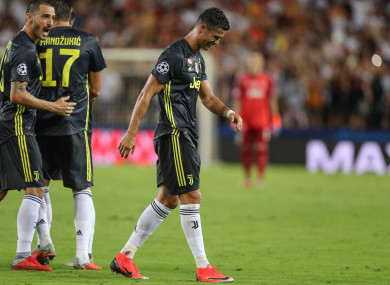Cristiano Ronaldo walks off after receiving a red card.