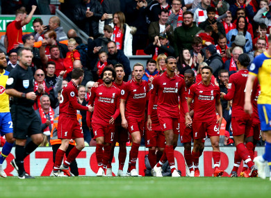 Mohamed Salah celebrates scoring Liverpool's third at Anfield.