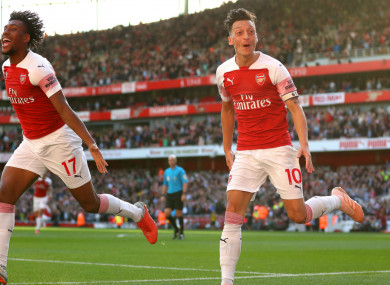 Arsenal's Mesut Ozil celebrates scoring late on Saturday.