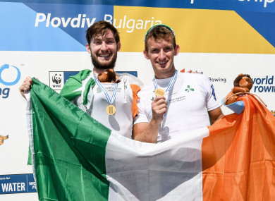 Paul and Gary O'Donovan celebrate with their gold medals.