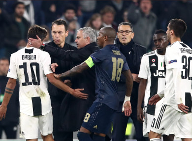 Manchester United manager Jose Mourinho (centre) cups Juventus' Paulo Dybala's (left) ear.