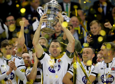 Brian Gartland lifts the FAI Cup after full-time at the Aviva Stadium.