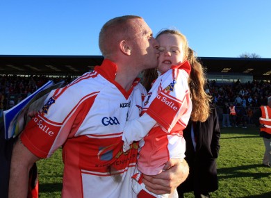John Mullane kisses his daughter Abby after De La Salle's win over Ballygunner in the Waterford SHC final at Walsh Park on Sunday.