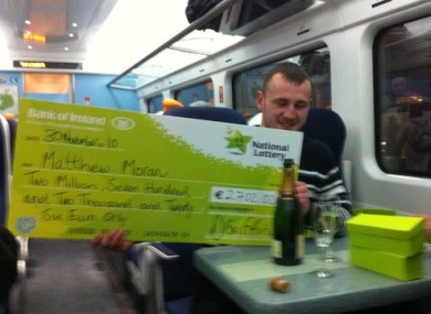 Matthew Moran celebrates his €2.7m win on the train home to Wexford yesterday