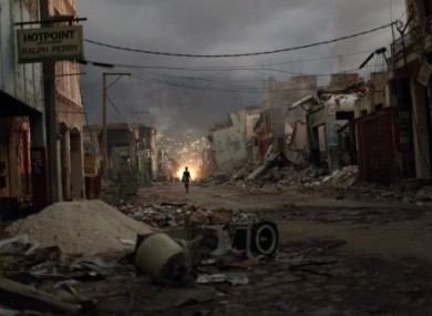 A woman walks downtown in earthquake-torn Port-au-Prince.