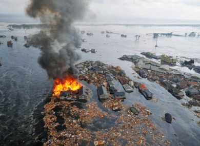 Houses and buildings are seen washed away by massive tsunami waves after a powerful quake in a photo taken from a Kyodo News helicopter in Natori, Miyagi Prefecture, northeastern Japan, on March 11, 2011.
