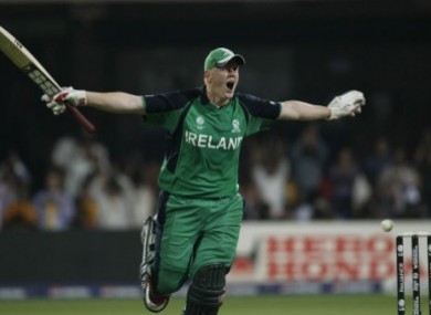 Kevin O'Brien celebrates his record-breaking century during the Cricket World Cup match against England
