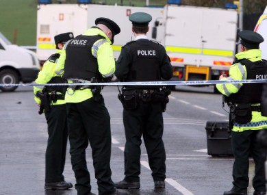 Police officers at the scene where one of their colleagues was killed in an under car booby trap explosion, in Omagh Co Tyrone.