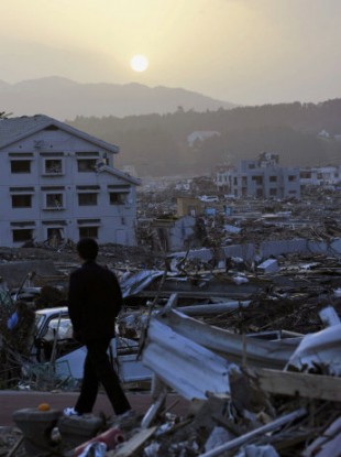 A boy walks along a road at sunset on May 13, 2011, in the town of Minamisanriku, Miyagi Prefecture, which was devastated by the March 11 earthquake and tsunami.