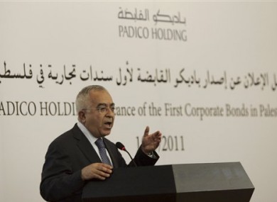 Palestinian Prime Minister Salam Fayyad speaks at a ceremony announcing the first Palestinian commercial financial bond, in the West Bank city of Ramallah, Tuesday, May 10, 2011.