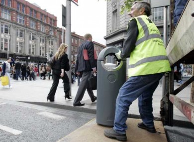 Bins get binned! Council workers remove rubbish bins on O'Connell Street in Dublin ahead of the Queen's visit.
