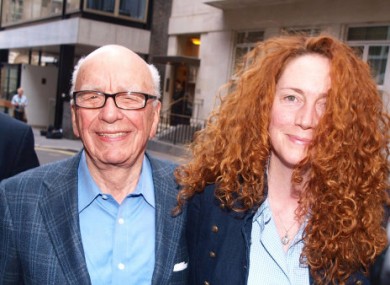 News International chief executive Rebekah Brooks and Rupert Murdoch are seen outside Murdochs London flat.
