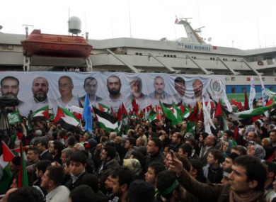 Pro-Palestinian activists cheer as the Mavi Marmara ship returns to Turkey last December. The boat was the scene of a bloody raid on 31 May, 2010, by Israeli marines who were ordered to stop the vessel from reaching Gaza.