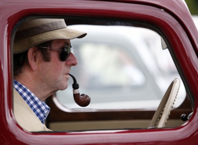 A vintage car enthusiast gets into the spirit at the 34th Irish Veteran & Vintage Car Club Powerscourt Picnic today.