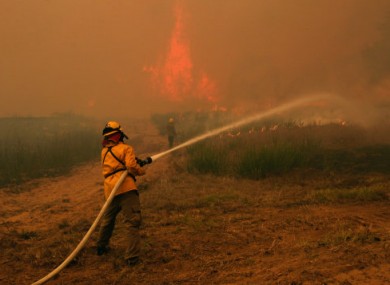 Firefighters tackle a blaze near Smithville, Texas.