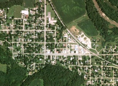 The small community of Tiskilwa, Illinois, seen from the air. The train derailed from the railway line visible looping from centre north to east of the picture.