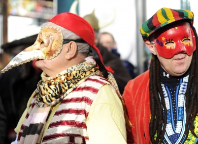 Tom Ahern and Pat McEvoy take part in the 27th annual Wren Boys parade in Sandymount in Dublin.