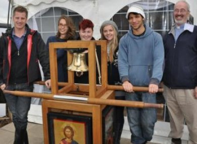 IEC volunteers with the Eucharistic Congress Bell, which will today be rung by Pope Benedict XVI inviting people to attend this year's congress in Dublin.