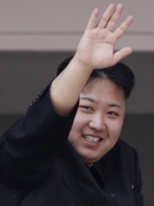 North Korean leader Kim Jong Un waves from a balcony