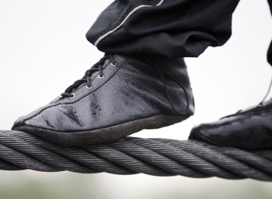 The feet of Nik Wallenda as he trains in the rain for a tightrope walk across Niagara Falls