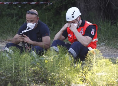 Rescue workers searching for three missing employees at a factory in northern Italy