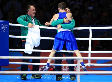 Michael Conlan celebrates with coach Billy Walsh.