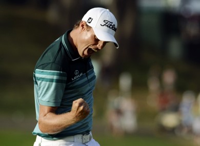 In contention: Nick Watney celebrates after sinking a birdie putt at the Barclays.