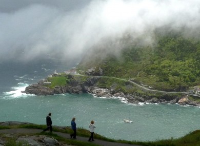 A fog blows into the harbor in St. John's, Newfoundland