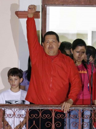 Chavez greets his supporters at the Miraflores presidential palace balcony in Caracas