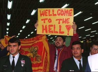 A Galatasaray fan reveals the now-infamous banner.