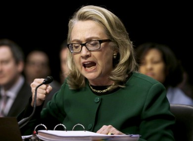 US Secretary of State Hillary Rodham Clinton pounding her fist as she testified on Capitol Hill in Washington today.