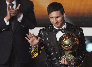 Argentina's Lionel Messi poses with the trophy after winning the FIFA Men's World Player of the Year Award.