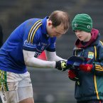Kerry's Darran O'Sullivan signs an autograph for a Kerry supporter after the game. Pic: INPHO/Cathal Noonan