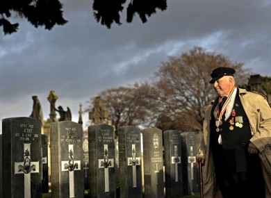 Tommy McKenzie from Dublin who served with the Australian Army pays his respects at 43 headstones for Irish servicemen and women from both World Wars who lie in unmarked graves in the cemetery