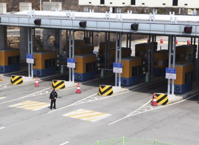 A South Korean security guard stands in front of the gateways to the North Korean city of Kaesong, which the North has blocked off to access from the south.
