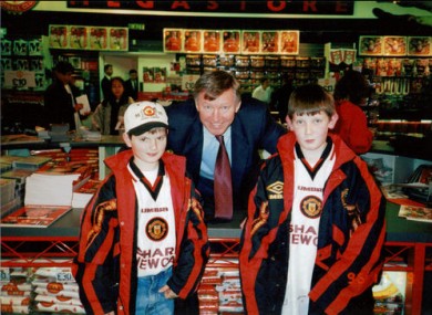 Alex Ferguson poses for a picture with James Phelan and his friend.