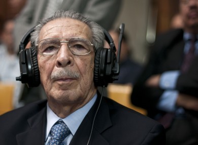 Guatemala's former dictator Jose Efrain Rios Montt wears headphones as he listens to the verdict in his genocide trial in Guatemala City