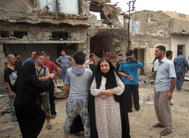 Residents react to a car bomb attack in Kirkuk, 180 miles north of Baghdad.