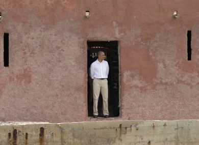 Barack Obama looks out to sea through the 'Door of No Return,' at the slave house on Goree Island, in Dakar, Senegal.