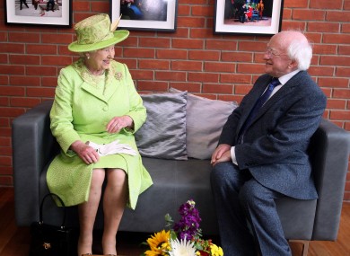 Queen Elizabeth II meets Irish President Michael D. Higgins during a visit to the Lyric Theatre in Belfast.