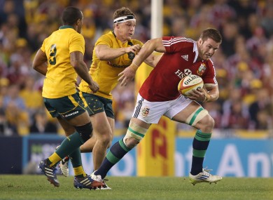 Sean O'Brien streaks away from Michael Hooper of Australia.