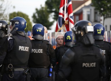 File image of an Orangemen confronting riot police in the Woodvale area of North Belfast on July 13.