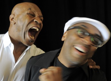 Mike Tyson takes a mock bite at the show's director, Spike Lee.