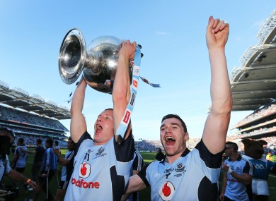Ciaran Kilkenny and Paddy Andrews celebrate with the Sam Maguire cup after Dublin beat Mayo in the All-Ireland final.