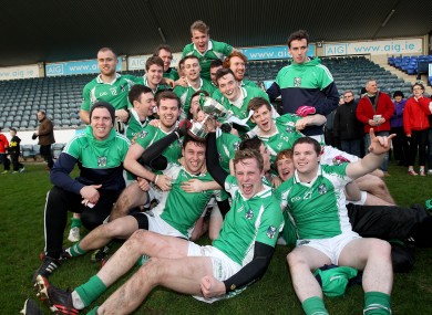 Geraldines' players celebrate with the trophy in Parnell Park.