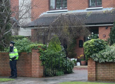 A Garda stands on duty outside the Minister for Justice, Alan Shatter's, house in South Dublin this afternoon.