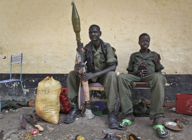 Rebels sit in the now-emptied hospital in Malakal.